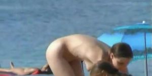 Hot pointy boobs and a girl with a shaved head in this beach video