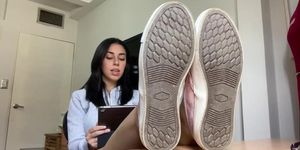 Latina shows feet while reading