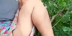 Thai aunty shaved pussy flashing on a tree