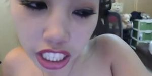Asian webcam girl masturbates with a dildo