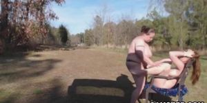 Lesbian anal strap on sex outdoors
