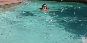 Cute Chubby Girl in the pool having fun