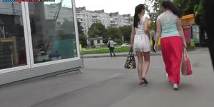 Girl walks with her girlfriend in the amateur upskirt scene