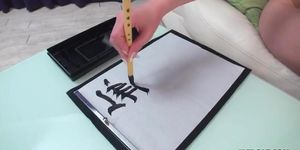 Asian writes characters and gives a footjob