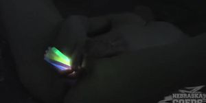 Girl masturbates vagina using glow sticks