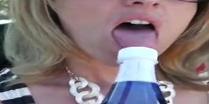 Amateur wife fucks her wet pussy with a bottle