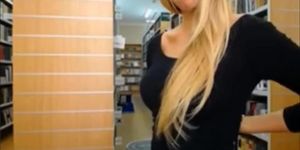 Great looking blondie disrobing and flashing tits in library