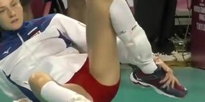 Pro sport girl stretches on the floor (Camera Man)