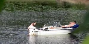 Nudist couple has fun in the middle of a beautiful lake