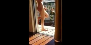 Masturbating naked in his balcony