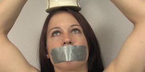 Naked Woman with Duct Taped Mouth