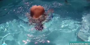 Sexy Candy swims and strips nude underwater