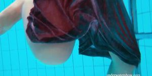 Brunette Nata Szilva strips underwater and gets horny