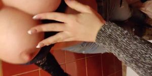 squirting and drinking milk from friend in public bathroom (Angie Lynx)