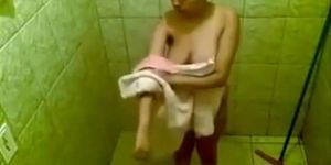 Large-breasted desi woman gets clean in the shower