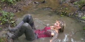 Beautiful Blonde in Leather Leggins and Wellies plays in Mud P2