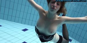 Hot blondie in stockings swims