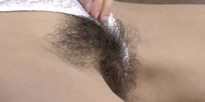 We Are Hairy - Efina masturbates with her makeup brush on a couch