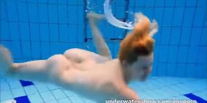 Cute Lucie stripping underwater
