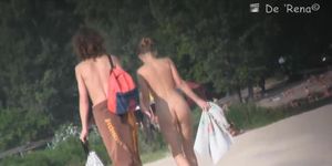 Stunning nude female body caught on a beach voyeur video