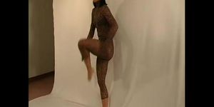 Flexible girl in nylon catsuit (clip)