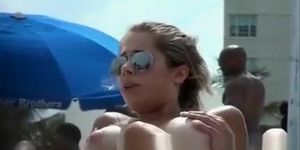 Topless beach girl with massive boobs