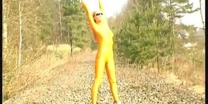 Blonde girl strips outdoor in spandex