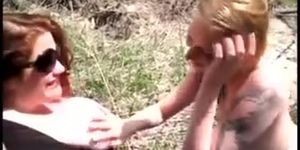 Two thick amateur lesbos play outdoors