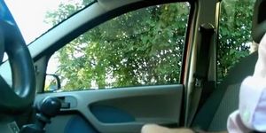 Guy plays with his dick inside car
