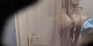 Spy shower cam gets mature girl showering
