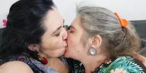 TWO MATURE KISSING