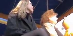 Public upskirt of the blonde with crossed legs in stockings