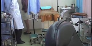 Kinky doc dildo penetrates Asian in the medical office