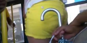 Girl in tight yellow shorts