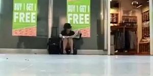 Sitting upskirt at the airport