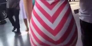 Big ass woman in tight white and pink dress