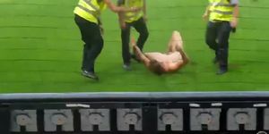 Nude maniac runs around the football field