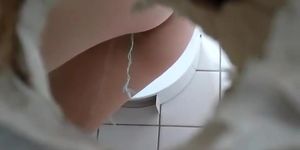 Watching a hot butt through a toilet hole