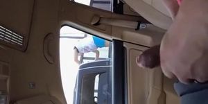 Guy strokes cock in car