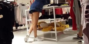 Candid voyeur two hot teens showing cheeks in shorts mall