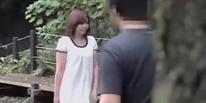 Sharking of a lovely Japanese girl in a public park