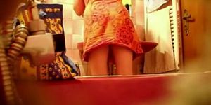 Spying a bent over wife in the bathroom