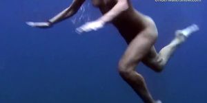 Hot babes get horny in the sea and touch bodies