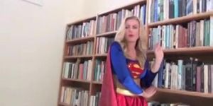 supergirl captured by a masked villainess in a black mini skirt & latex bra