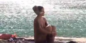 Araceli looks for a guy to screw around a nude beach