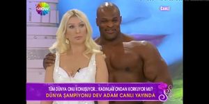Sexy Blonde Turkish anchor with Big Man on TV Show