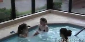 Amateur chicks stripping in a pool