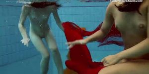 Mega hot and wet lesbos swimming and stripping