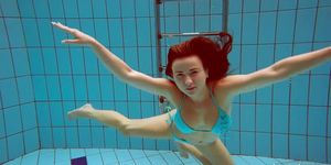Cute teen Deniska swimming naked in the pool