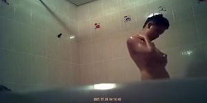 Asian woman spied showering in bathtub